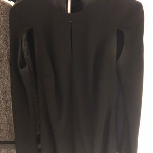 Gorgeous black dinner dress with several slits.